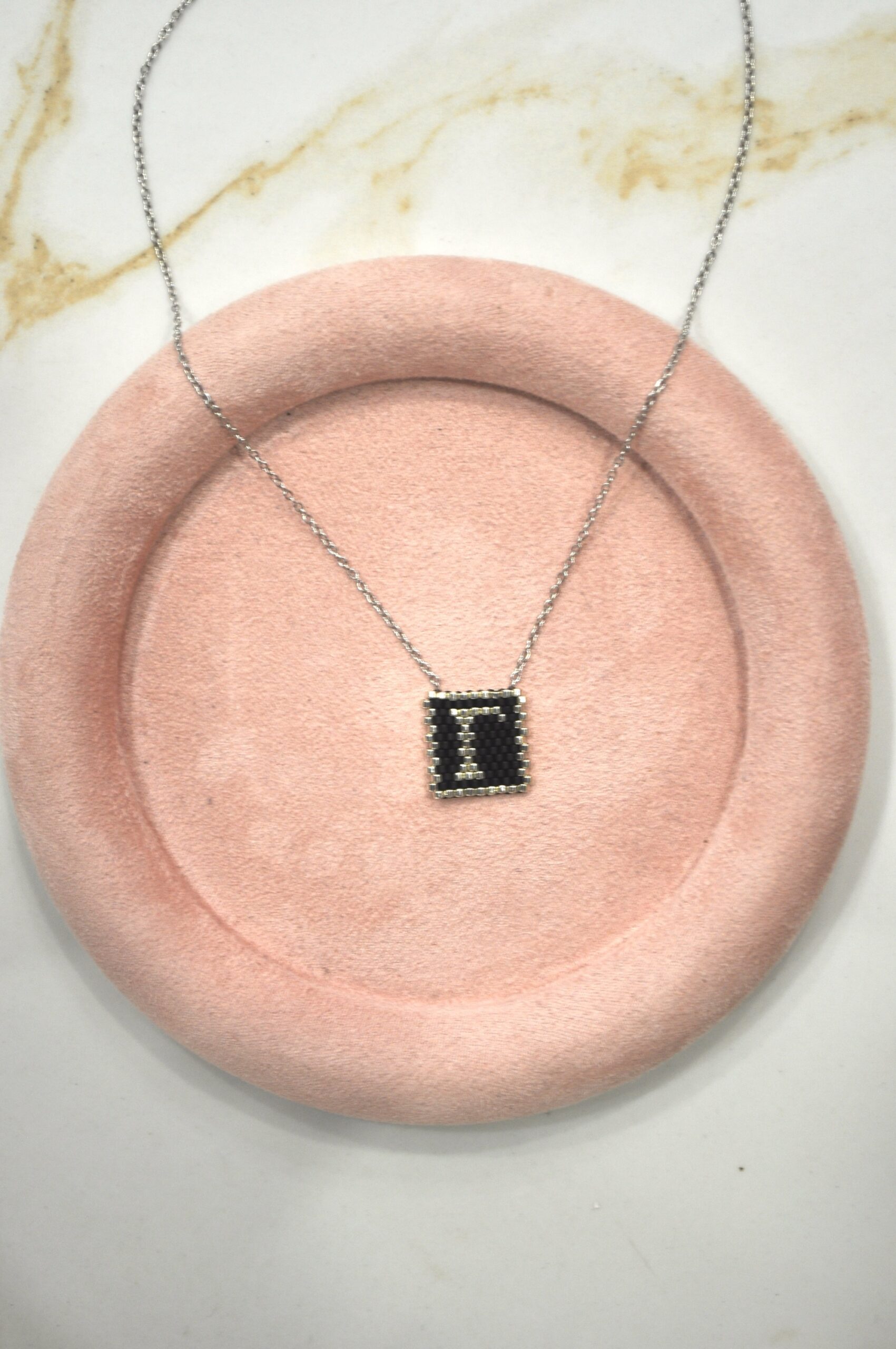 Monogram Γ.