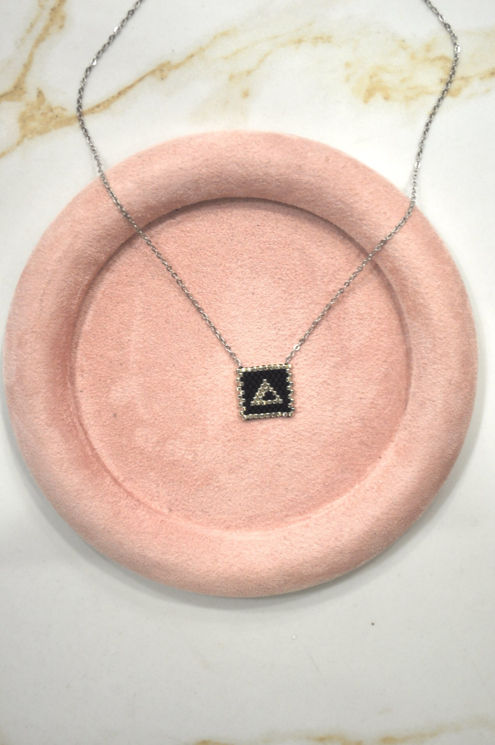 Monogram Δ.